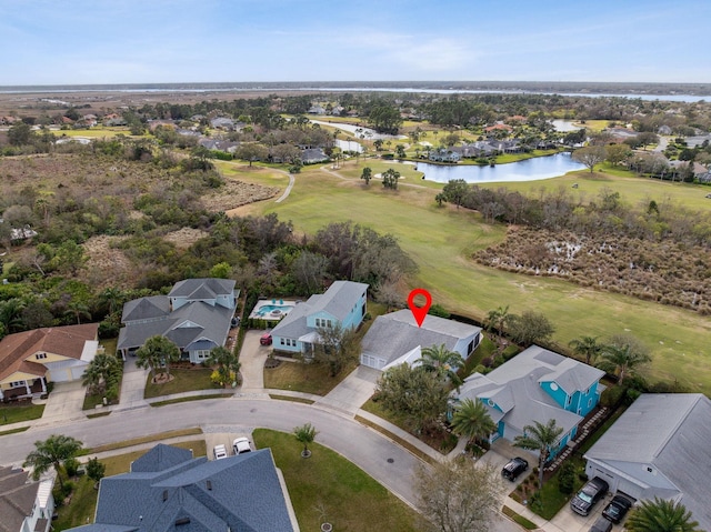 birds eye view of property featuring a residential view, view of golf course, and a water view