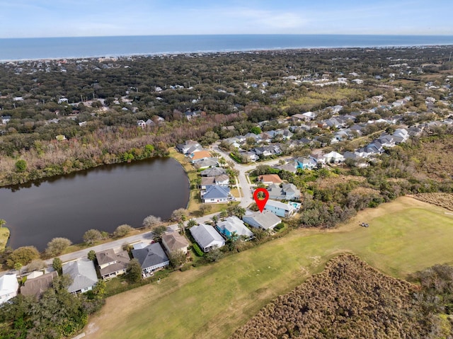 bird's eye view with a water view and a residential view