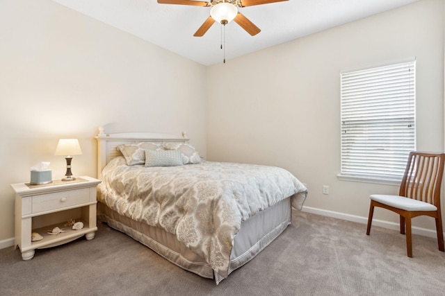 bedroom featuring baseboards, a ceiling fan, and light colored carpet