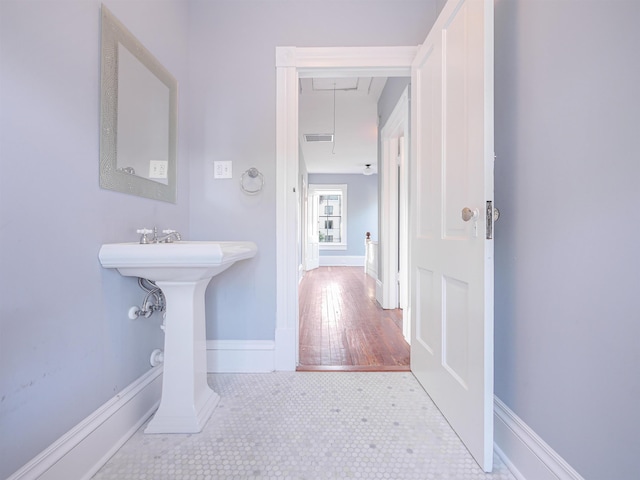 bathroom with tile patterned floors