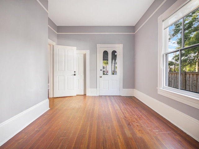 entryway with hardwood / wood-style floors