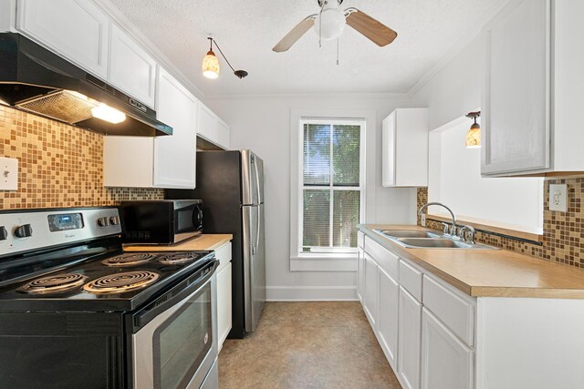 kitchen with white cabinets, sink, decorative backsplash, ceiling fan, and stainless steel appliances