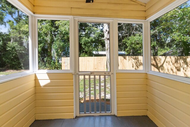 unfurnished sunroom featuring a wealth of natural light