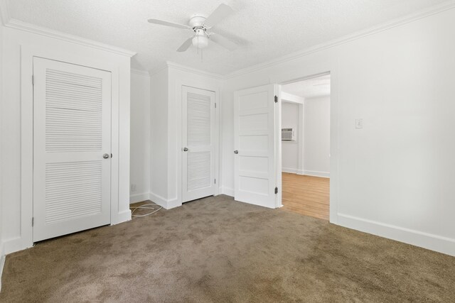 unfurnished bedroom featuring a textured ceiling, ceiling fan, carpet floors, and crown molding