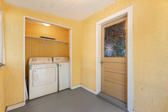 clothes washing area featuring washing machine and clothes dryer