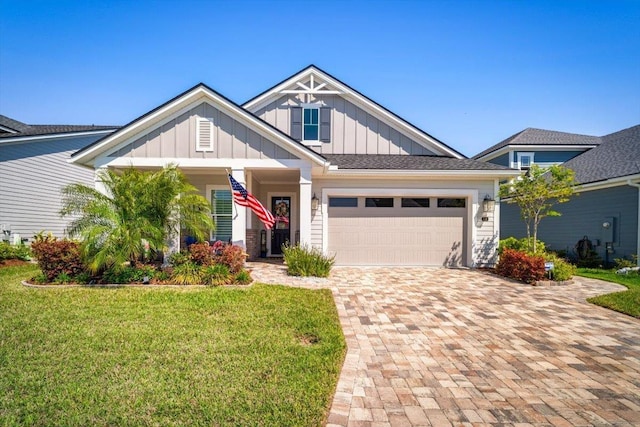 118 Lamego Ln, Saint Augustine, FL 32095 - craftsman-style home with a garage, board and batten siding, decorative driveway, and a front lawn