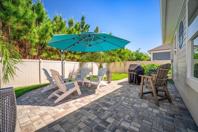 118 Lamego Ln, Saint Augustine, FL 32095 - view of patio with area for grilling and a fenced backyard