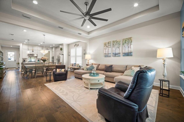 118 Lamego Ln, Saint Augustine, FL 32095 - living room with visible vents, a raised ceiling, plenty of natural light, ceiling fan, and dark wood-style floors