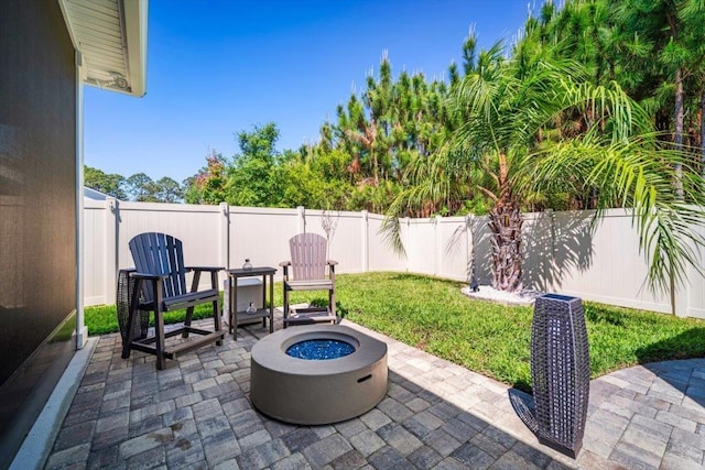 118 Lamego Ln, Saint Augustine, FL 32095 - view of patio featuring a fenced backyard and a fire pit