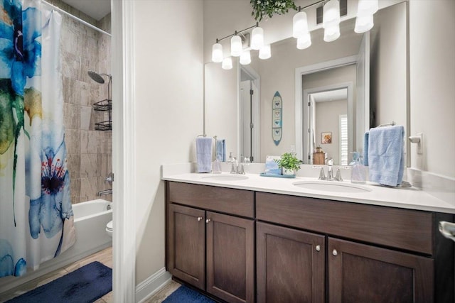 118 Lamego Ln, Saint Augustine, FL 32095 - bathroom featuring double vanity, shower / bath combination with curtain, baseboards, and a sink