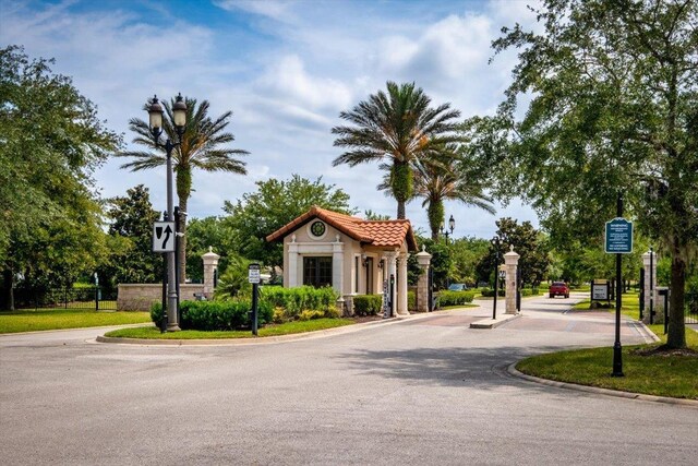 118 Lamego Ln, Saint Augustine, FL 32095 - view of street featuring curbs, street lighting, and a gated entry