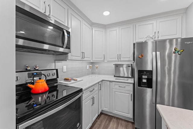 7 Andalusia Ct, Saint Augustine, FL 32086 - kitchen with appliances with stainless steel finishes, light countertops, white cabinetry, and recessed lighting