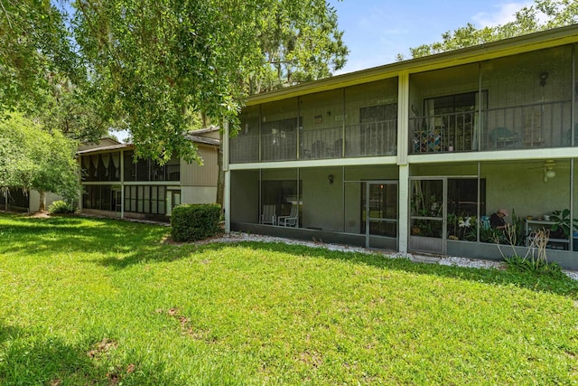 7 Andalusia Ct, Saint Augustine, FL 32086 - rear view of property with a sunroom and a yard