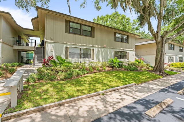 7 Andalusia Ct, Saint Augustine, FL 32086 - view of front of house with stairway and a front yard