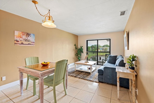 650 W Pope Rd Unit 208, Saint Augustine, FL 32080 - dining area with light tile patterned flooring and baseboards