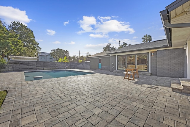 view of swimming pool featuring a patio