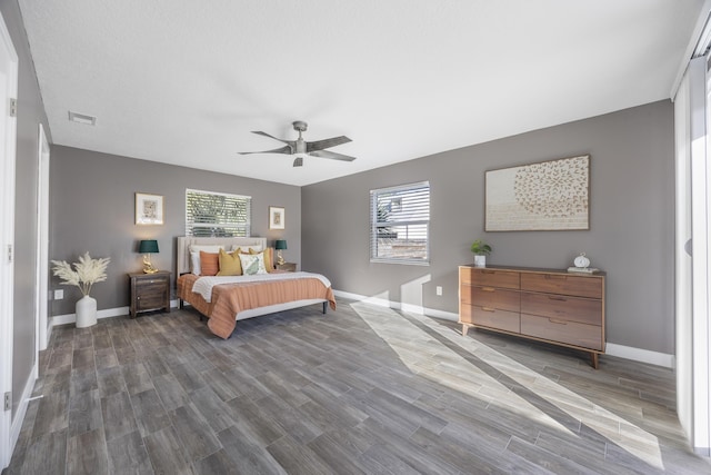 bedroom featuring ceiling fan and dark wood-type flooring