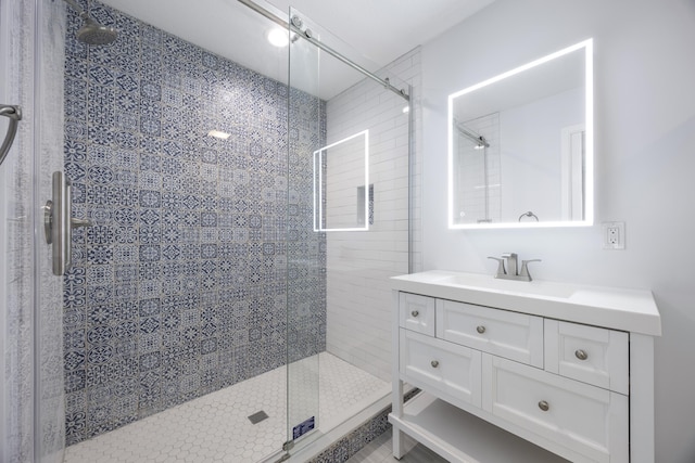 bathroom with vanity and an enclosed shower