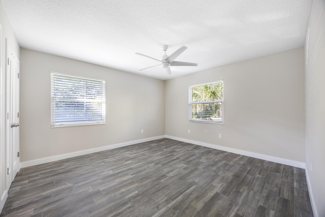 50 Dufferin St, Saint Augustine, FL 32084 - spare room with dark wood-style flooring, ceiling fan, and a textured ceiling