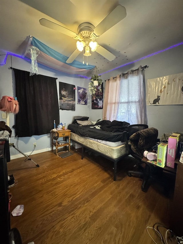 bedroom featuring ceiling fan and wood-type flooring