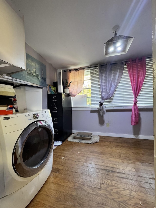 laundry room featuring washer / dryer and wood-type flooring