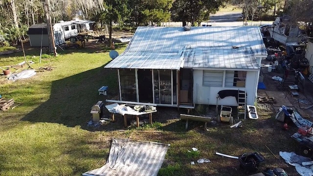 exterior space featuring a sunroom