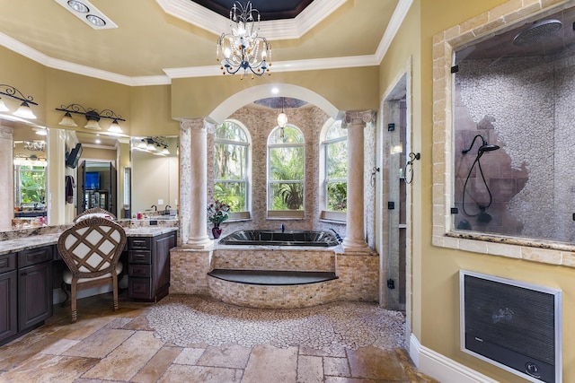 bathroom featuring vanity, decorative columns, ornamental molding, shower with separate bathtub, and heating unit