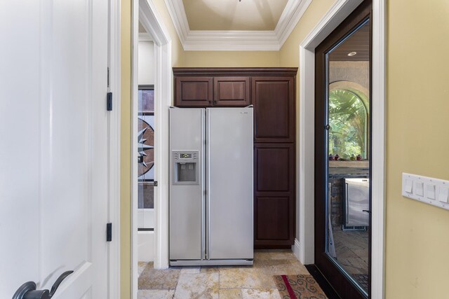 kitchen featuring dark brown cabinets, stainless steel fridge with ice dispenser, and crown molding