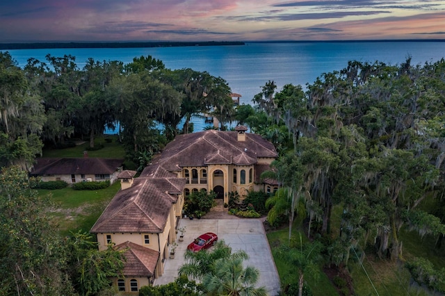 aerial view at dusk with a water view