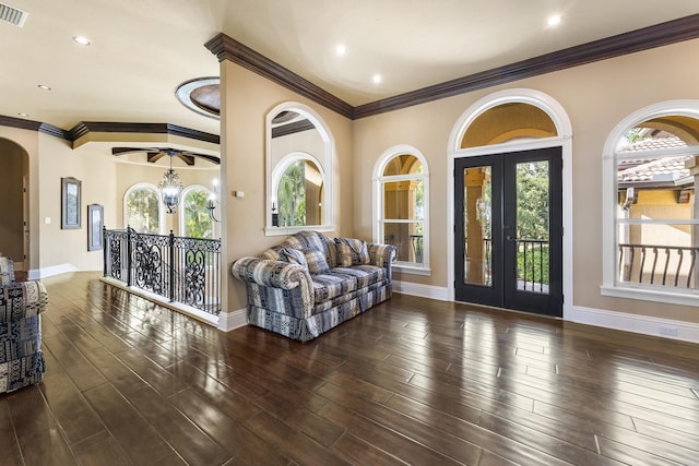 living room featuring dark wood-type flooring and ornamental molding