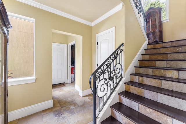 stairway featuring crown molding