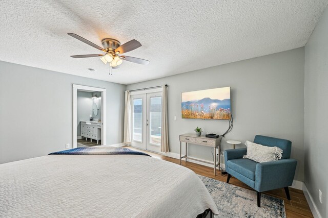 7201 A1A S, Saint Augustine, FL 32080 - bedroom featuring baseboards, a textured ceiling, access to exterior, ceiling fan, and wood finished floors
