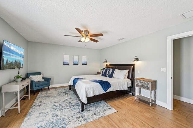 7201 A1A S, Saint Augustine, FL 32080 - bedroom featuring visible vents, baseboards, light wood finished floors, and a textured ceiling