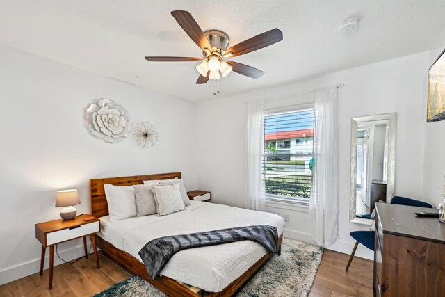 7201 A1A S, Saint Augustine, FL 32080 - bedroom with light wood finished floors, baseboards, and ceiling fan