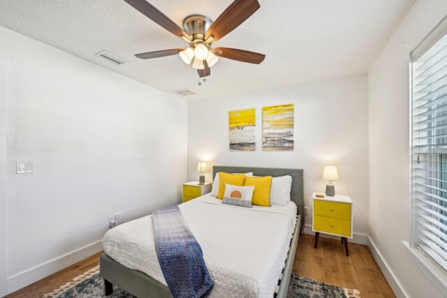 7201 A1A S, Saint Augustine, FL 32080 - bedroom with visible vents, baseboards, a ceiling fan, and wood finished floors