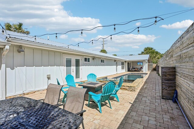7201 A1A S, Saint Augustine, FL 32080 - view of patio featuring a fenced in pool, french doors, a fenced backyard, and an outdoor fire pit