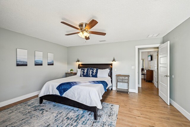 7201 A1A S, Saint Augustine, FL 32080 - bedroom featuring visible vents, baseboards, light wood finished floors, and a textured ceiling