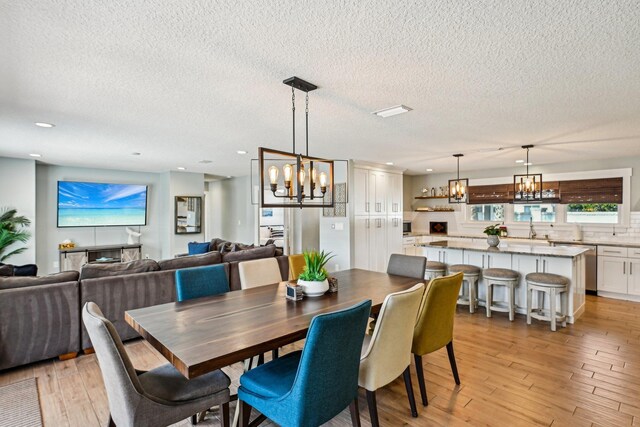 7201 A1A S, Saint Augustine, FL 32080 - dining space featuring recessed lighting, light wood-type flooring, and an inviting chandelier