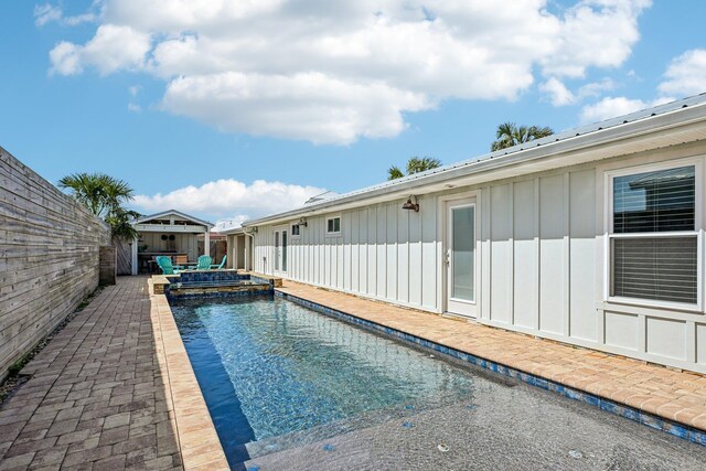 7201 A1A S, Saint Augustine, FL 32080 - view of swimming pool with a patio, a pool with connected hot tub, and a fenced backyard
