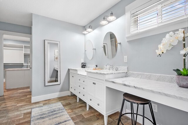 7201 A1A S, Saint Augustine, FL 32080 - bathroom featuring vanity, baseboards, and wood finished floors