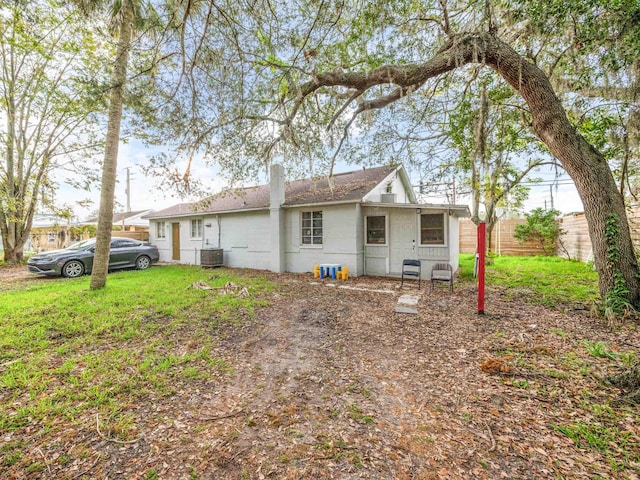 back of property featuring central AC unit