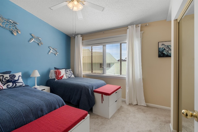 2900 Coastal Hwy, Saint Augustine, FL 32084 - bedroom featuring light carpet, a ceiling fan, and a textured ceiling