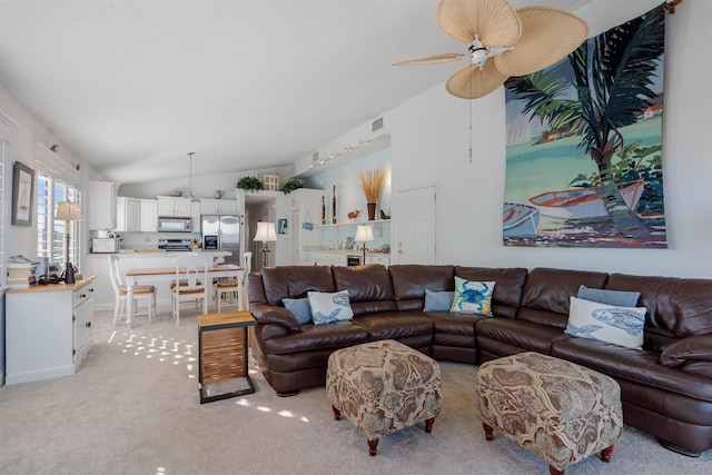 2900 Coastal Hwy, Saint Augustine, FL 32084 - living room with light colored carpet, lofted ceiling, a ceiling fan, and visible vents