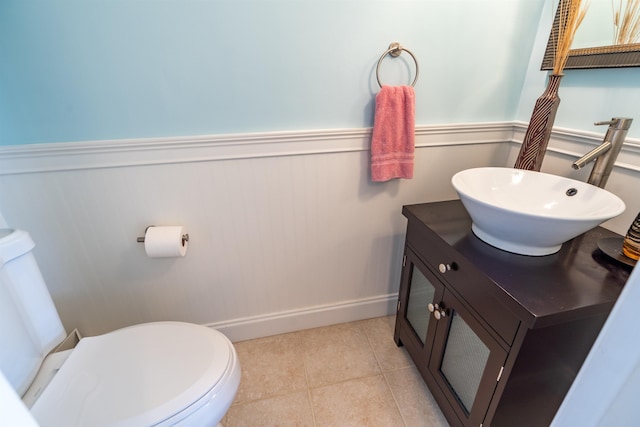 2900 Coastal Hwy, Saint Augustine, FL 32084 - bathroom with toilet, wainscoting, vanity, baseboards, and tile patterned flooring
