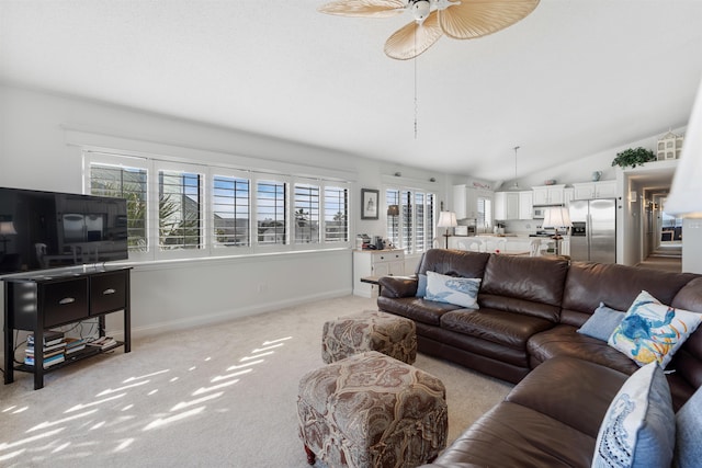 2900 Coastal Hwy, Saint Augustine, FL 32084 - living area with light colored carpet, a ceiling fan, lofted ceiling, and a healthy amount of sunlight