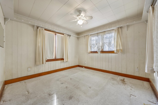 unfurnished room with ceiling fan