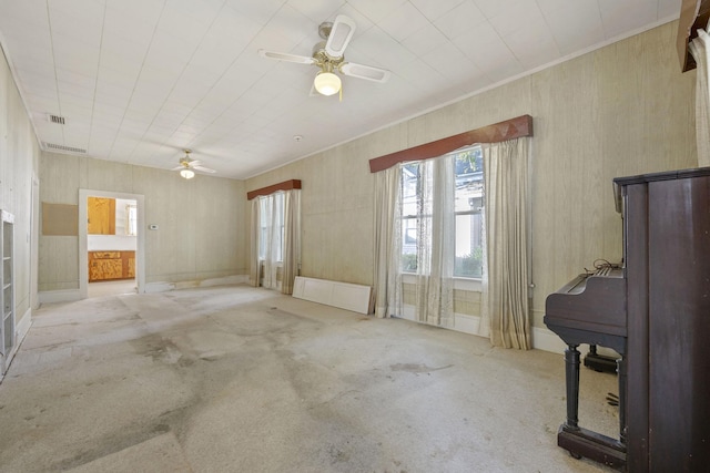 interior space with ceiling fan