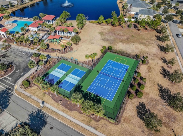 birds eye view of property with a water view