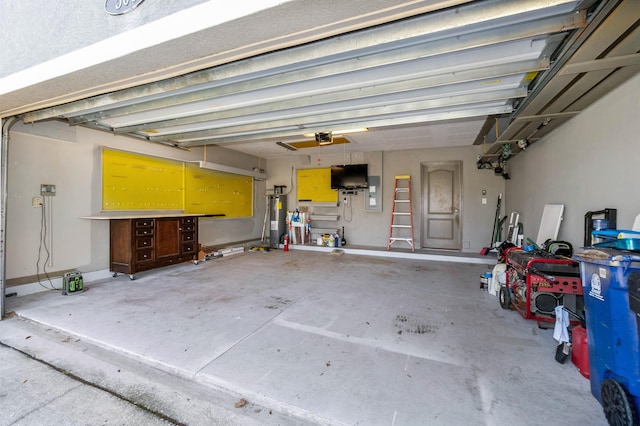 garage with water heater, a garage door opener, and electric panel