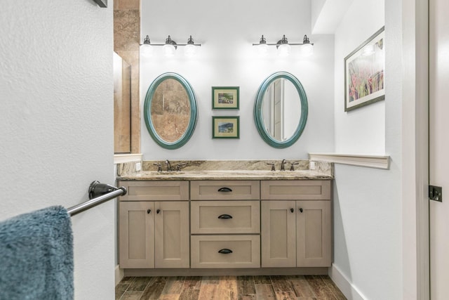 bathroom featuring vanity and hardwood / wood-style flooring